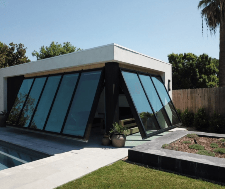 Serene Luxury: The Glass-Walled Pool House