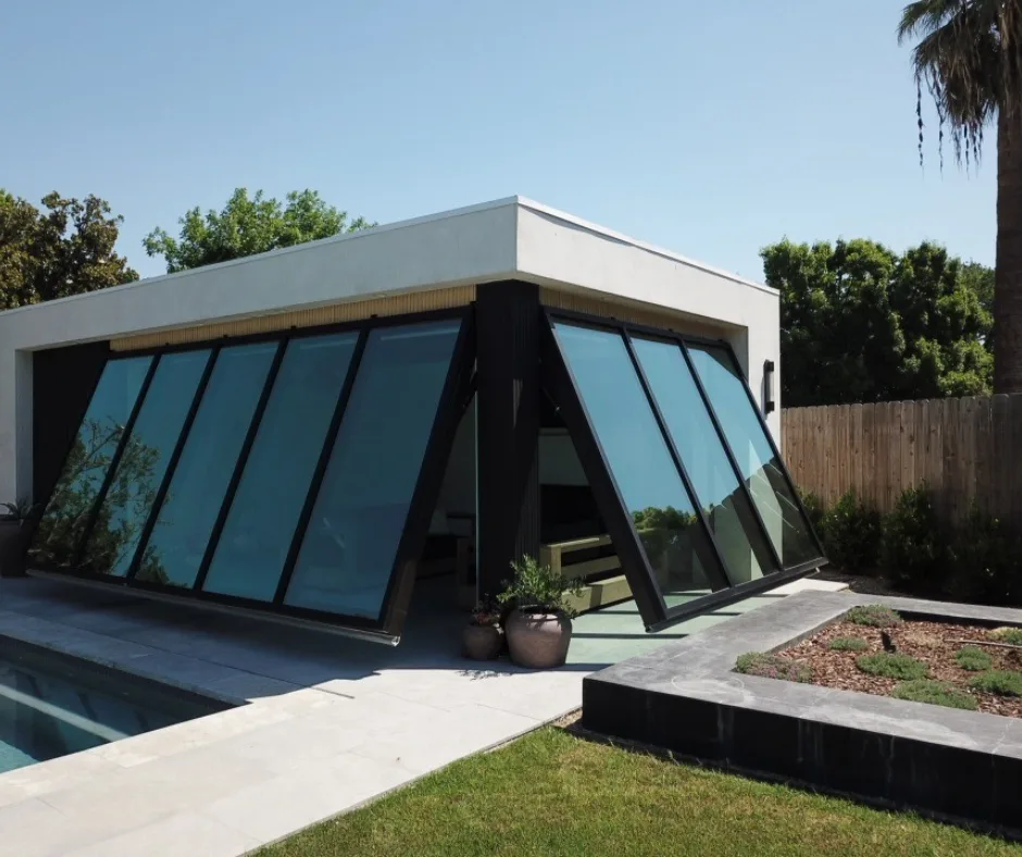 Serene Luxury: The Glass-Walled Pool House